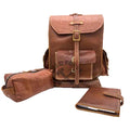 A brown leather backpack set displayed on a white studio background, including a main backpack with front flap and buckle closure, a matching Dopp kit, and a matching journal. 