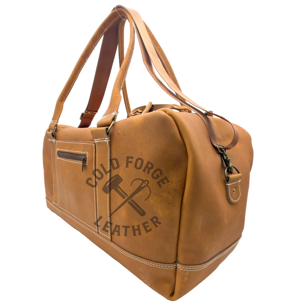 A tan leather duffel bag with double shoulder straps, a front zip pocket