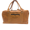 A tan leather duffel bag with dual top handles, a front zippered pocket, and a dark brown embossed logo reading 'COLD FORGED LEATHER' on a white studio background.