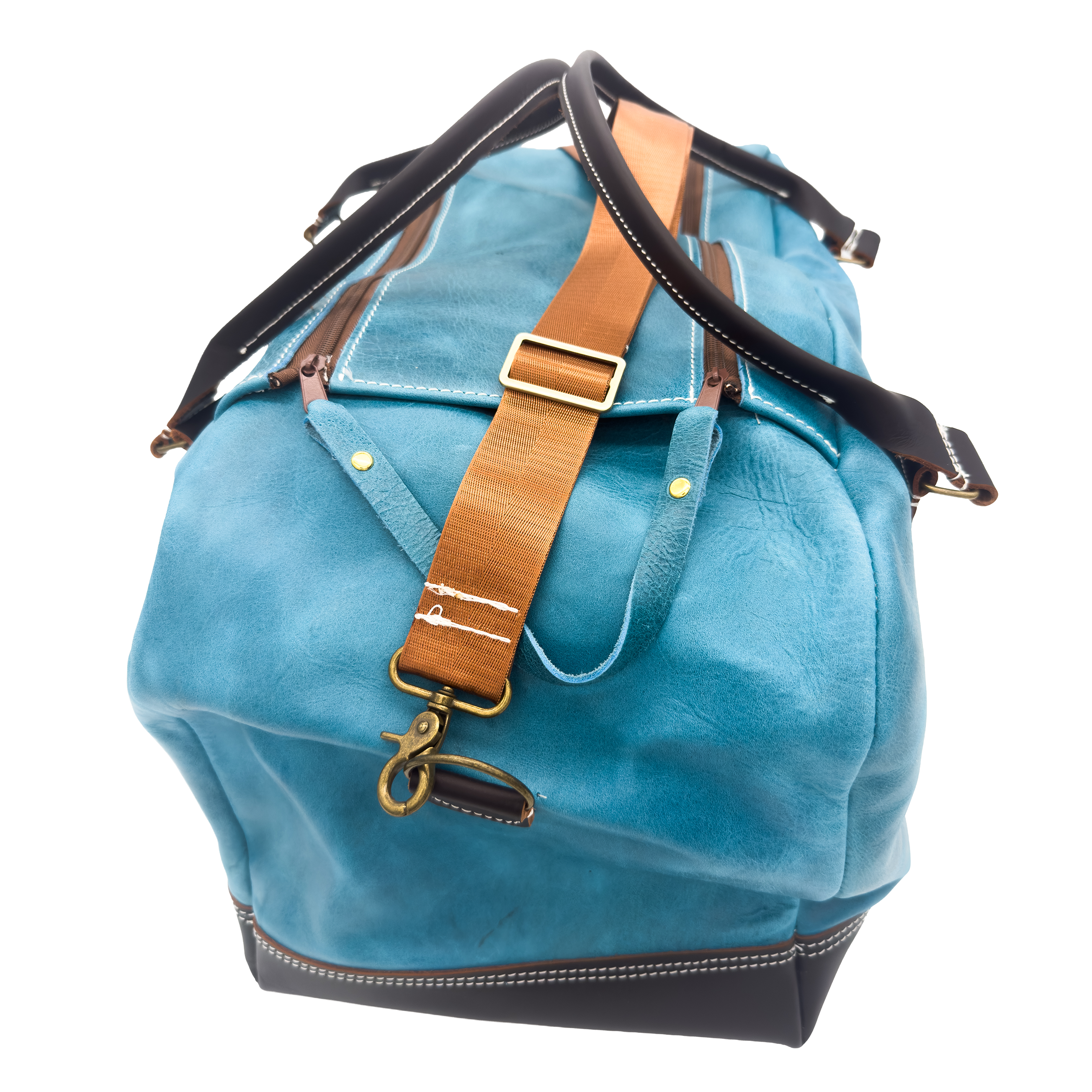 A blue leather duffel bag with black trim, a tan leather strap, and brass hardware, shown on a plain white background.